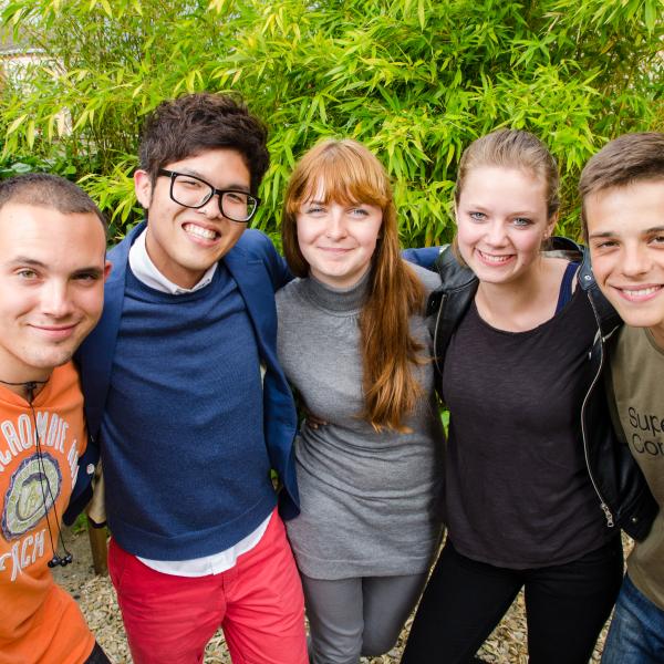 5 students in the OR garden looking happy