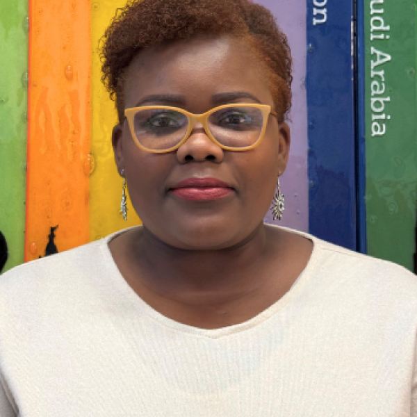 A portrait photo of Cynthia Onyegbado, International House Bristol's OET Exams Officer and Venue Manager