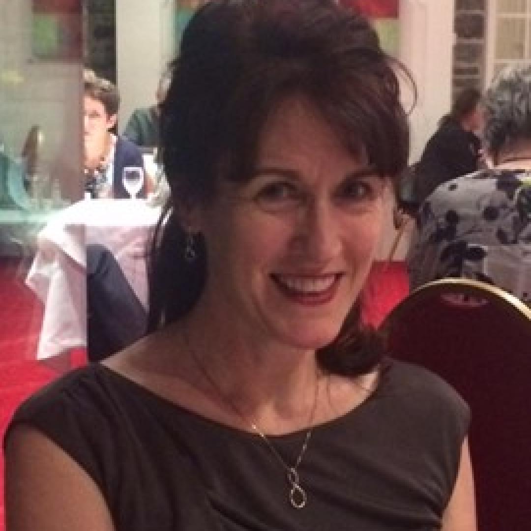 Val, IH Bristol's director, sat at a gala dinner.